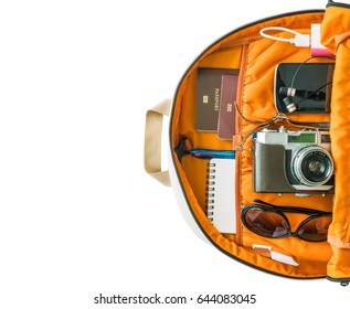 Retro Camera Film And Traveler's Accessories For The Trip On The Bag Ready For Travel, Travel Background, Tourist Essentials, Top View,  Isolated On A White Background