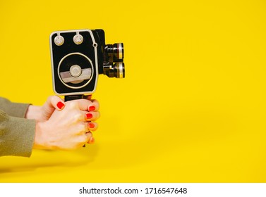 Retro Camera. Hand Holds A Retro Video Camera.