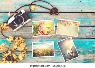 Retro Camera And Instant Paper Photo Album On Wood Table With Flowers Border Design - Photo Of Remembrance And Nostalgia In Spring. Vintage Style