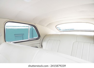 retro car interior. Vintage dashboards. Luxury leather steering wheel. Auto controls.
White interior. Car chairs and seats. Car sofa. Back and front row. Interior and door trim. Classic look - Powered by Shutterstock