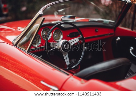 Retro car rally. French riviera. Nice - Cannes - Saint-Tropez. Red retro car concept.
