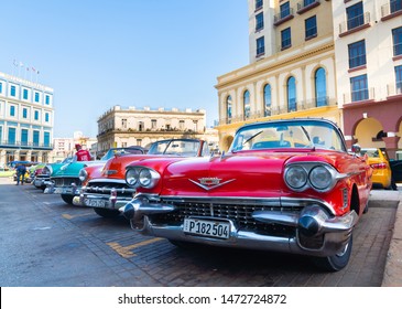 Retro car as taxi for tourists in Havana, Cuba. Captured near Gran Teatro de La Habana, El Capitolio and Paseo del Prado in spring 2019 - Shutterstock ID 1472724872