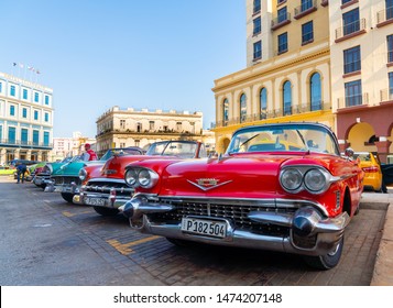 Retro car as taxi for tourists in Havana, Cuba. Captured near Gran Teatro de La Habana, El Capitolio and Paseo del Prado in spring 2019 - Shutterstock ID 1474207148