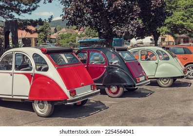 retro cars of different colors in the parking lot - Powered by Shutterstock