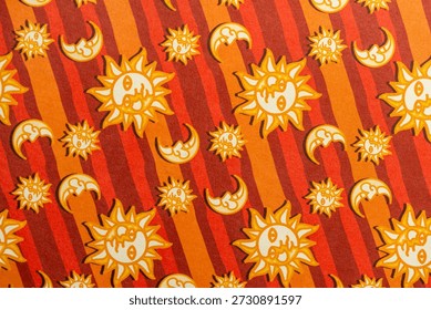 Retro Celestial Pattern with Sun and Moon Icons on Orange and Red Stripes
