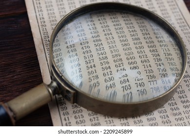 Retro Cipher And Cryptanalysis. Old Vintage Magnifying Glass With Calc Table.