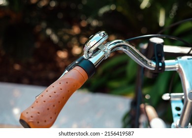 Retro city bike synthetic leather handlebar grip  and bell close up - Powered by Shutterstock