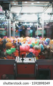 Retro Claw Machine Toy Arcade game filled with teddy bears and children's stuffed animal toys