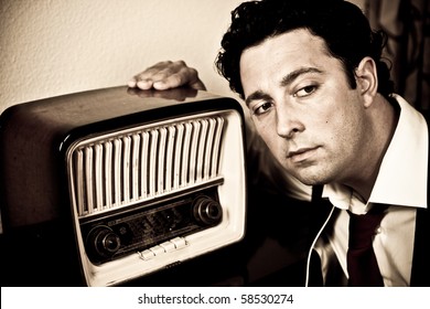 Retro - close up of dressed up man listening to old radio