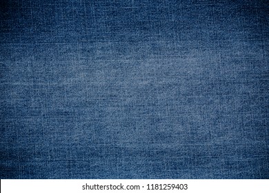 Retro color tone of blue denim jeans fabric texture for background website fashion design or backdrop product.