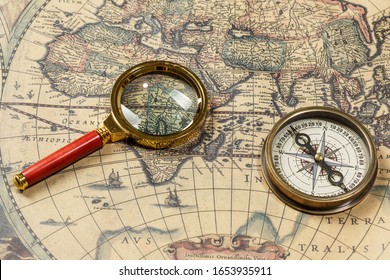 Retro compass with old map and magnifier - Shutterstock ID 1653935911