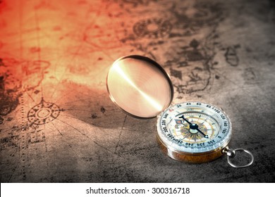 Retro compass on ancient world map, vintage style 