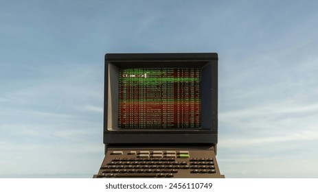 retro computer on a beach with data and code on screen