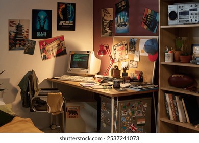 Retro computer setup on desk decorated with vintage posters, various writing tools, and personal items creating nostalgic ambiance