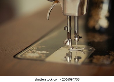 Retro Concept. Close Up Of Back Side Of Vintage Sewing Machine In Dress Atelier. Copy-space. Indoor Shot