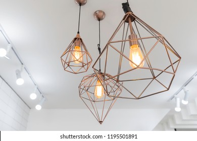 retro copper hanging lamp with orange light bulb. - Powered by Shutterstock