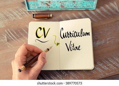 Retro Effect And Toned Image Of A Woman Hand Writing A Note With A Fountain Pen On A Notebook. Business Acronym CV As Curriculum Vitae As Business Concept Image