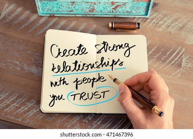 Retro Effect And Toned Image Of A Woman Hand Writing A Note With A Fountain Pen On A Notebook. Handwritten Text Create Strong Relationships With People You Trust As Success And Evolution Concept Image