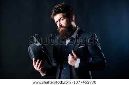 Retro fashion hat. Man with hat. Vintage fashion. Man well groomed bearded gentleman on dark background. Male fashion and menswear. Formal suit classic style outfit. Elegant and stylish hipster.