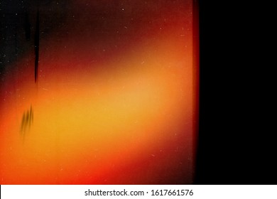 Retro Film Photography Effect. Red Abstract Background. Retro Film Photo Effect. Noise Texture.  Lens Flare And Heavy Grain. 70s