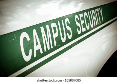 Retro Filtered Campus Security Sign On The Side Of A University Vehicle