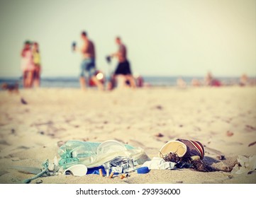 Retro Filtered Garbage On A Beach Left By Tourist, Environmental Pollution Concept Picture, Baltic Sea, Poland.