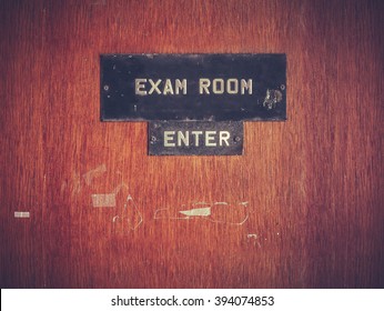 Retro Filtered Image Of A Grungy Exam Room Door At A Public School In The USA