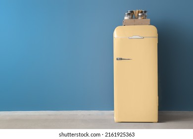 Retro Fridge Near Blue Wall