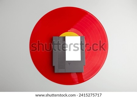 retro game soundtrack 8-bit game cartridge on a vinyl record