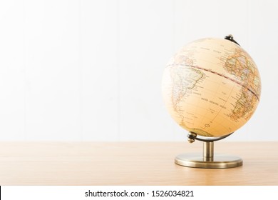 Retro Globe On Wooden Desk