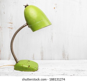 Retro Green Desk Lamp On White Wooden Table 