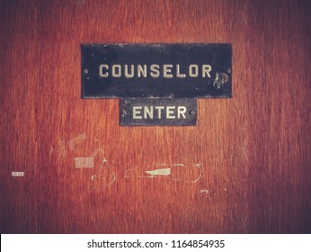 Retro Grungy Counselor's Office Door At A Public School Or University