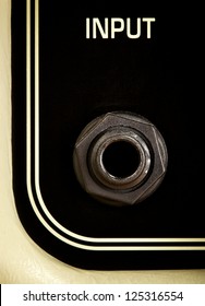 retro guitar amplifier panel, input jack, close up