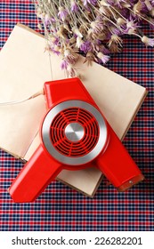 Retro Hairdryer And Book On Table, Close Up