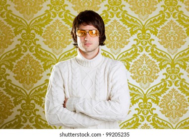 retro hip young man with vintage glasses and winter  turtleneck sweater on wallpaper