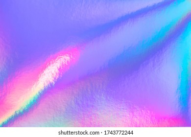 Retro holographic foil background, great design for any purposes. Abstract colorful vibrant blur iridescent gradient. Retro futuristic label design.