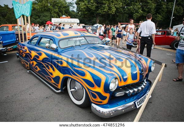 Retro hot rod\
car tuning show.Custom painted classic American vehicle with orange\
flames. MOSCOW-7\
AUGUST,2016: