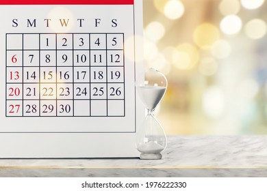 Retro Hourglass And Calendar Concept For Time Slipping Away