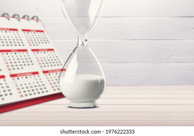 Retro Hourglass And Calendar Concept For Time Slipping Away