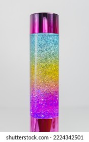 A Retro Iconic Rainbow Coloured Lava Lamp Isolated On A White Background. Vibrant Colourful Kids Lava Lamps For Nightlight And Home Decoration