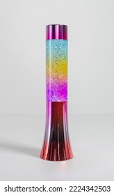 A Retro Iconic Rainbow Coloured Lava Lamp Isolated On A White Background. Vibrant Colourful Kids Lava Lamps For Nightlight And Home Decoration