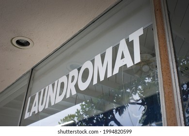 Retro Laundromat Sign On Window