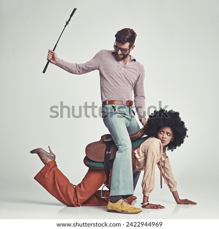 Retro, man and woman or riding crop in studio with piggyback, portrait and funny face for vintage style. Friends, people and 70s outfit with hipster clothes or comic expression with white background Stock photo © 