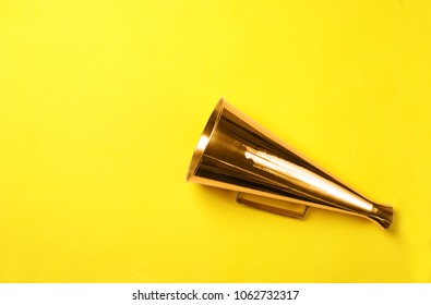 Retro megaphone on color background