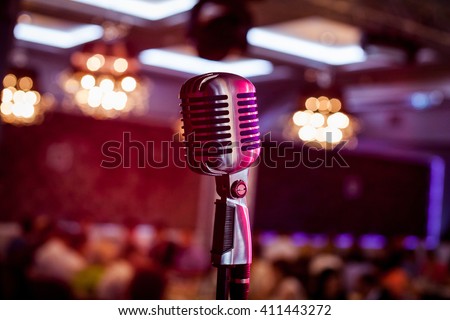 Retro microphone on stage in a pub or American Bar(restaurant) during a night show. 