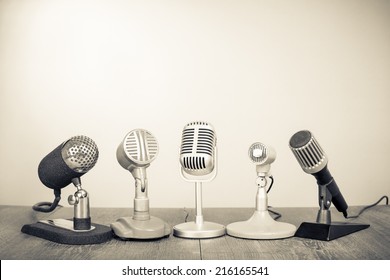 Retro microphones for press conference or interview. Vintage old style sepia photography