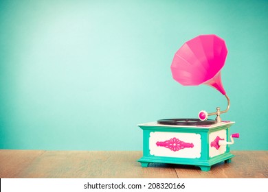 Retro old gramophone radio receiver front mint green background - Shutterstock ID 208320166