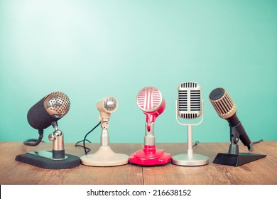 Retro old microphones for press conference or interview on table - Shutterstock ID 216638152