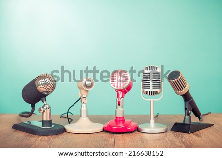 Retro old microphones for press conference or interview on table