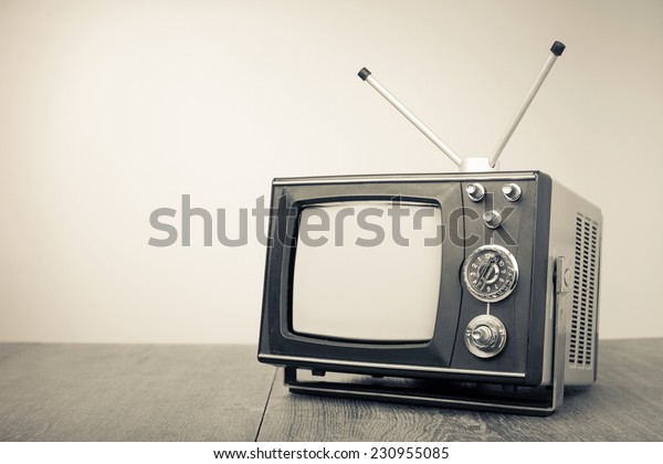 Retro\
old portable television. Vintage style sepia\
photo